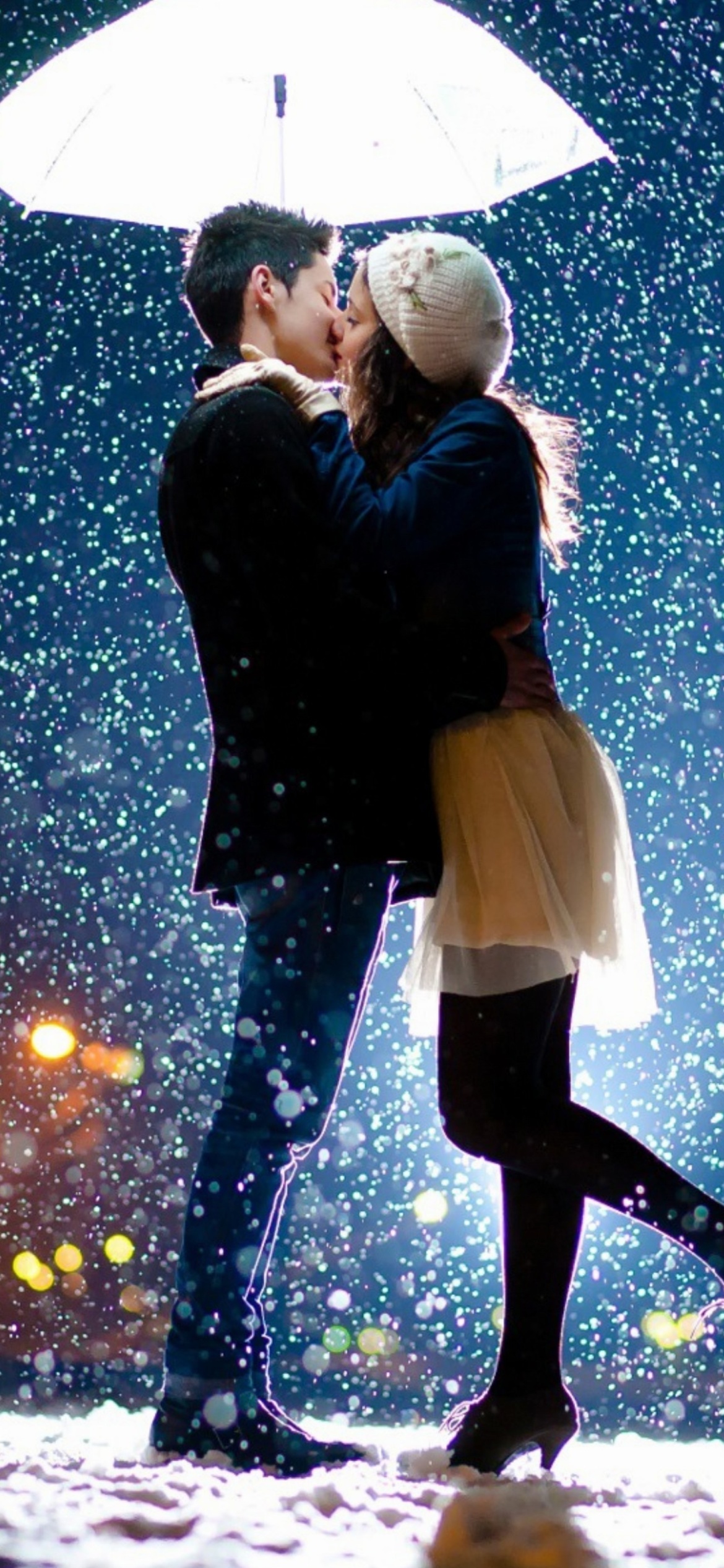 Kissing under snow wallpaper 1170x2532