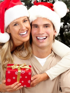 Happy Couple In Christmas And New Year's Eve wallpaper 240x320