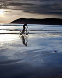Fondo de pantalla Bicycle Ride By Beach 128x160