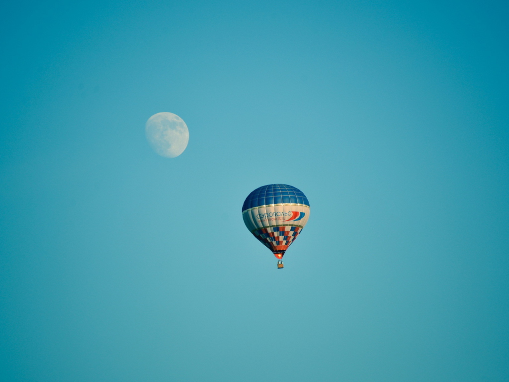 Air Balloon In Blue Sky In Front Of White Moon wallpaper 1024x768