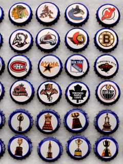 Fondo de pantalla Bottle caps with NHL Teams Logo 240x320