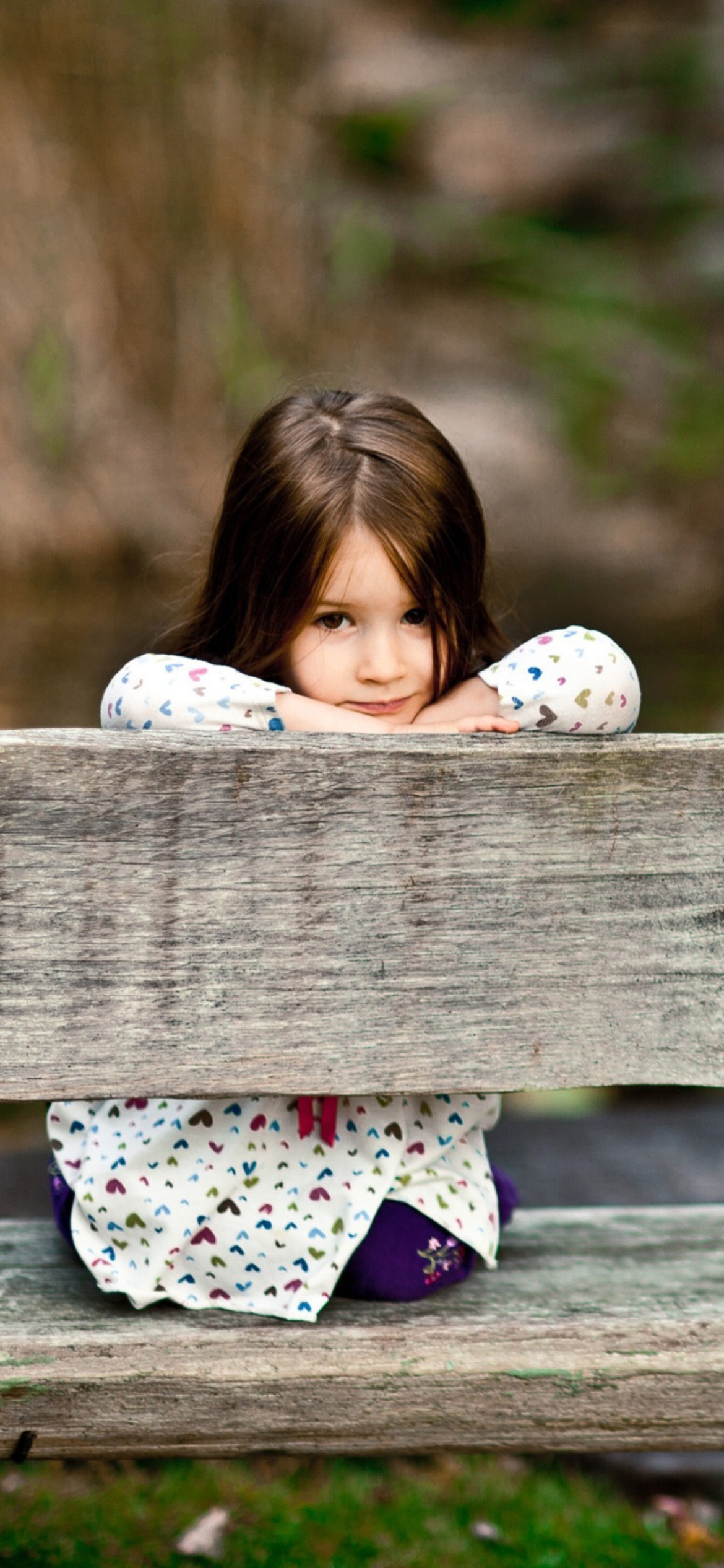 Child Sitting On Bench wallpaper 1170x2532