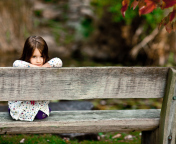 Child Sitting On Bench wallpaper 176x144