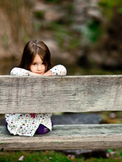 Das Child Sitting On Bench Wallpaper 240x320