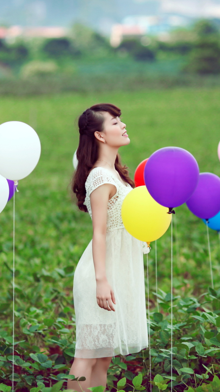 Fondo de pantalla Girl And Colorful Balloons 750x1334