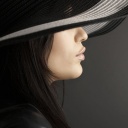 Woman in Black Hat wallpaper 128x128