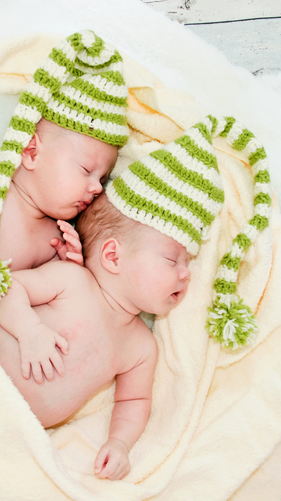 Cute Babies In Green Hats Sleeping wallpaper 1080x1920