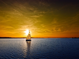 Fondo de pantalla Boat At Sunset 320x240