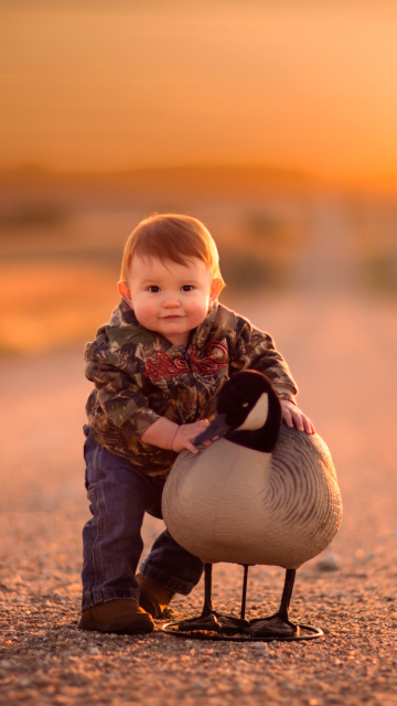 Kid and Duck wallpaper 360x640