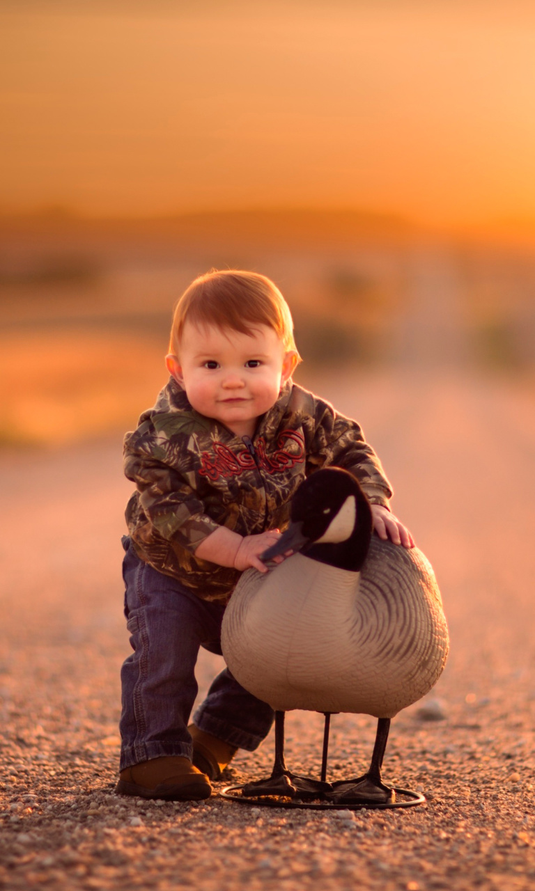 Kid and Duck wallpaper 768x1280