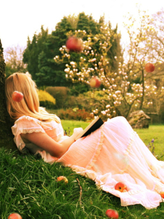Sfondi Blonde Girl Reading Book Under Tree 240x320