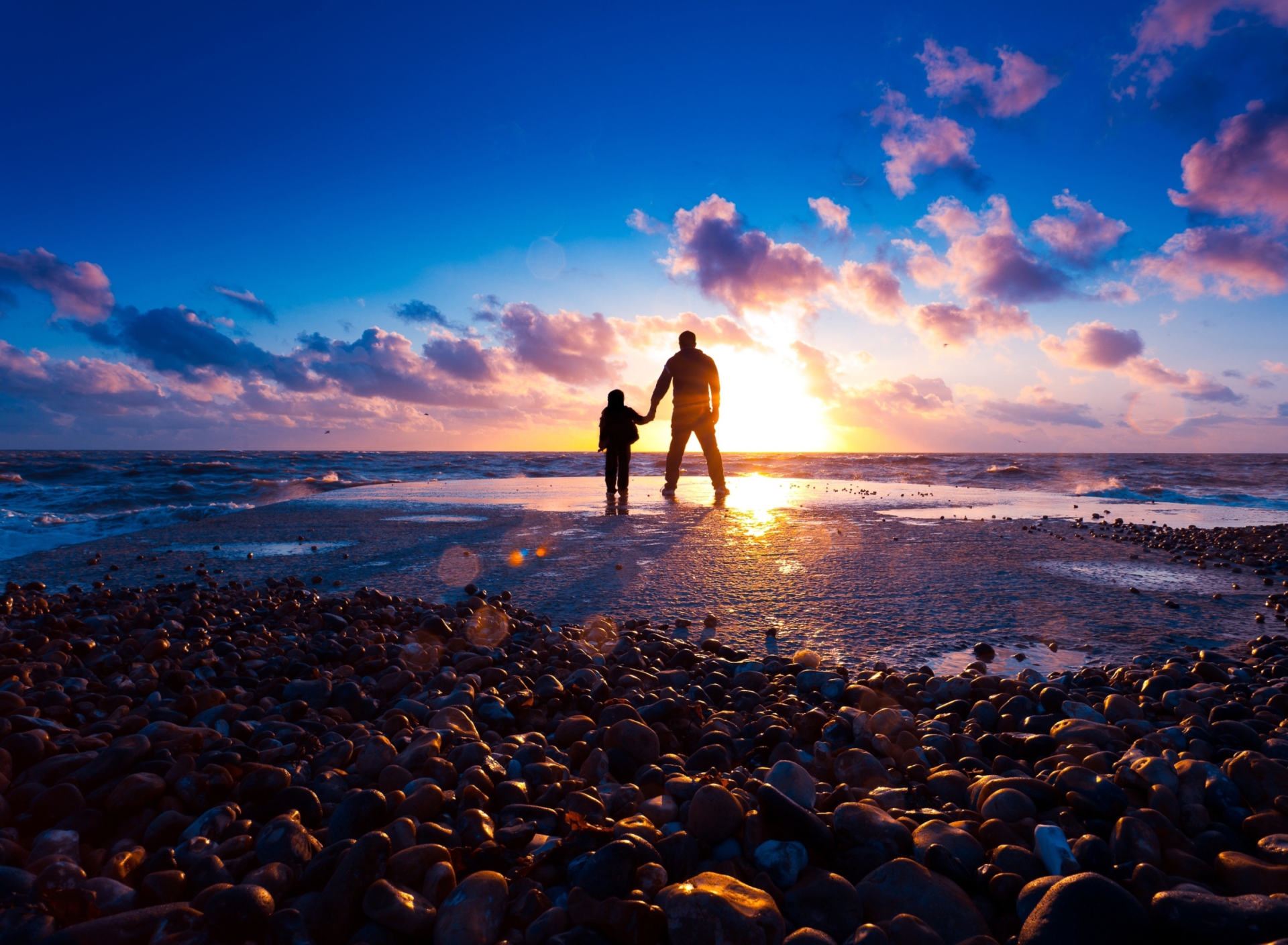 Father And Son On Beach At Sunset wallpaper 1920x1408