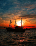 Fondo de pantalla Ship in sunset 128x160
