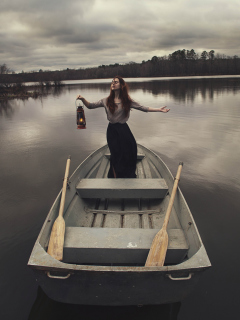 Fondo de pantalla Girl In Boat With Candle 240x320
