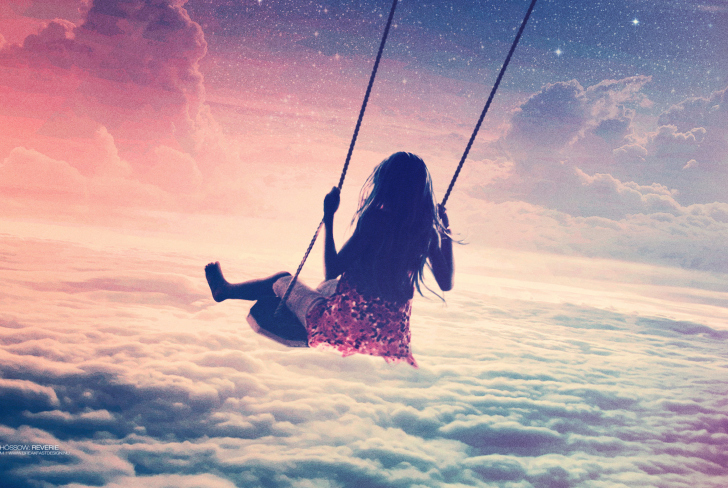 Girl On Swing Above Cloudy Sky wallpaper