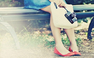 Girl With Camera Sitting On Bench Wallpaper for Android, iPhone and iPad
