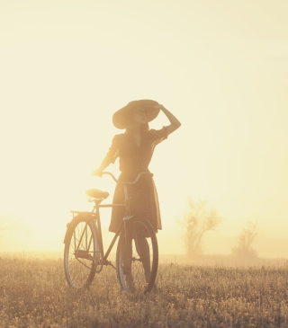 Girl And Bicycle On Misty Day Background for 240x320