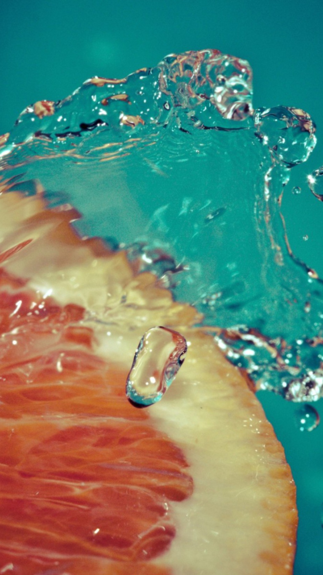 Orange Slice In Water Drops wallpaper 1080x1920