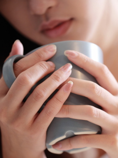 Cup Of Tea In Girl's Hands wallpaper 240x320