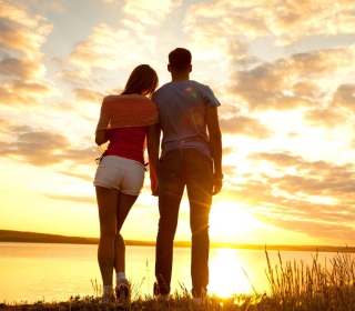 Couple Watching Sunset Wallpaper for iPad 3