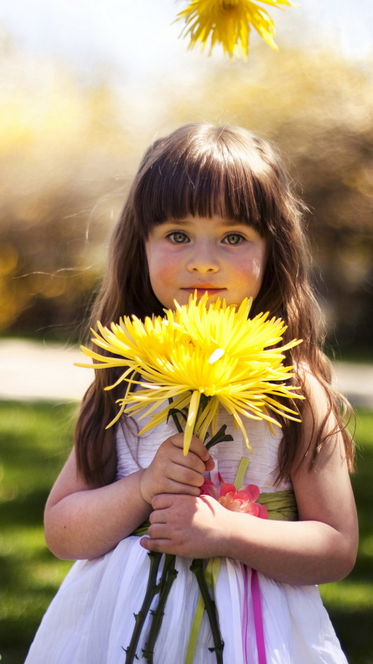 Sweet Child With Yellow Flower Bouquet wallpaper 750x1334