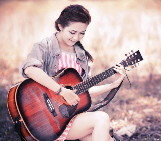 Kostenloses Asian Girl With Guitar Wallpaper für iPad mini