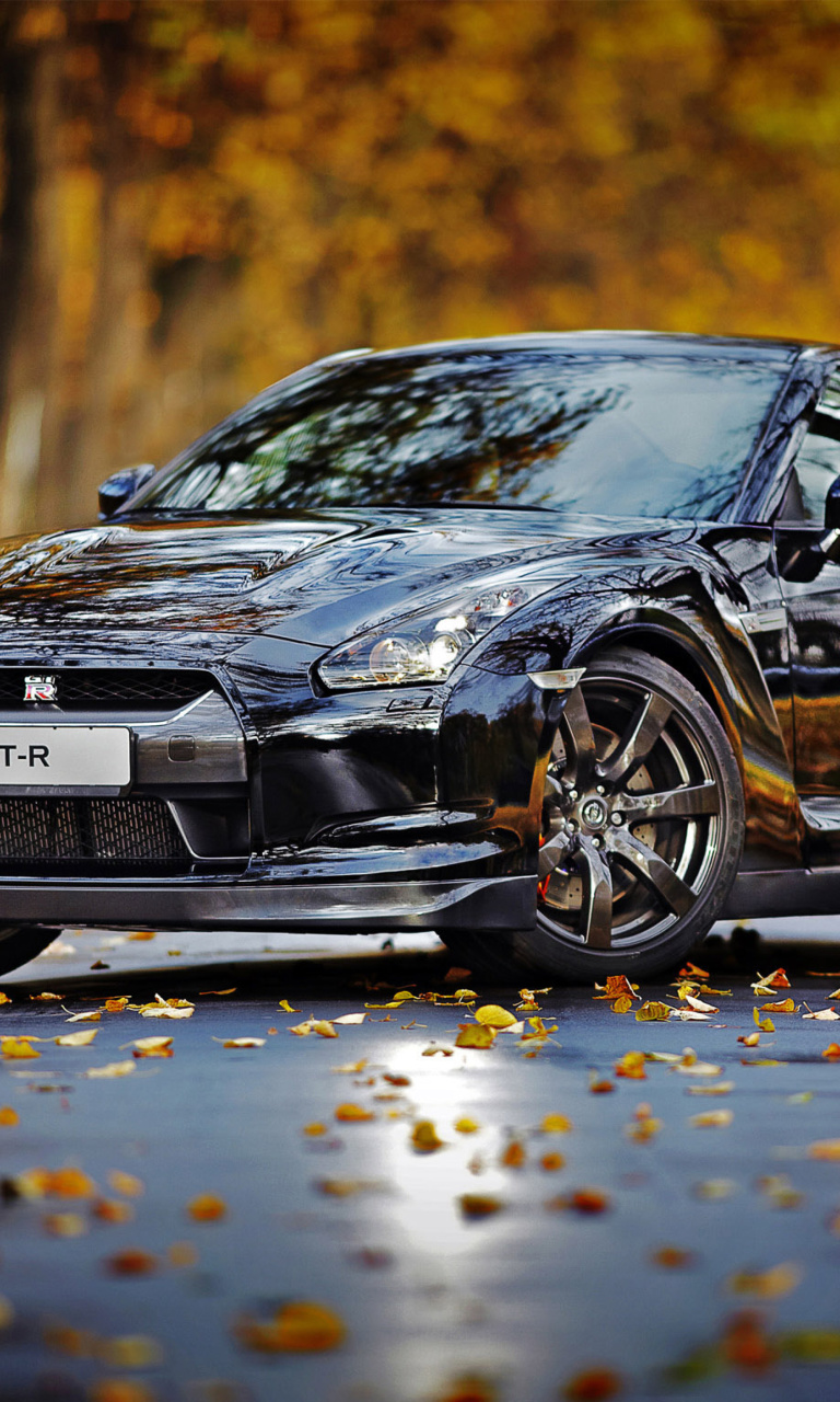 Обои Nissan GT R in Autumn Forest 768x1280