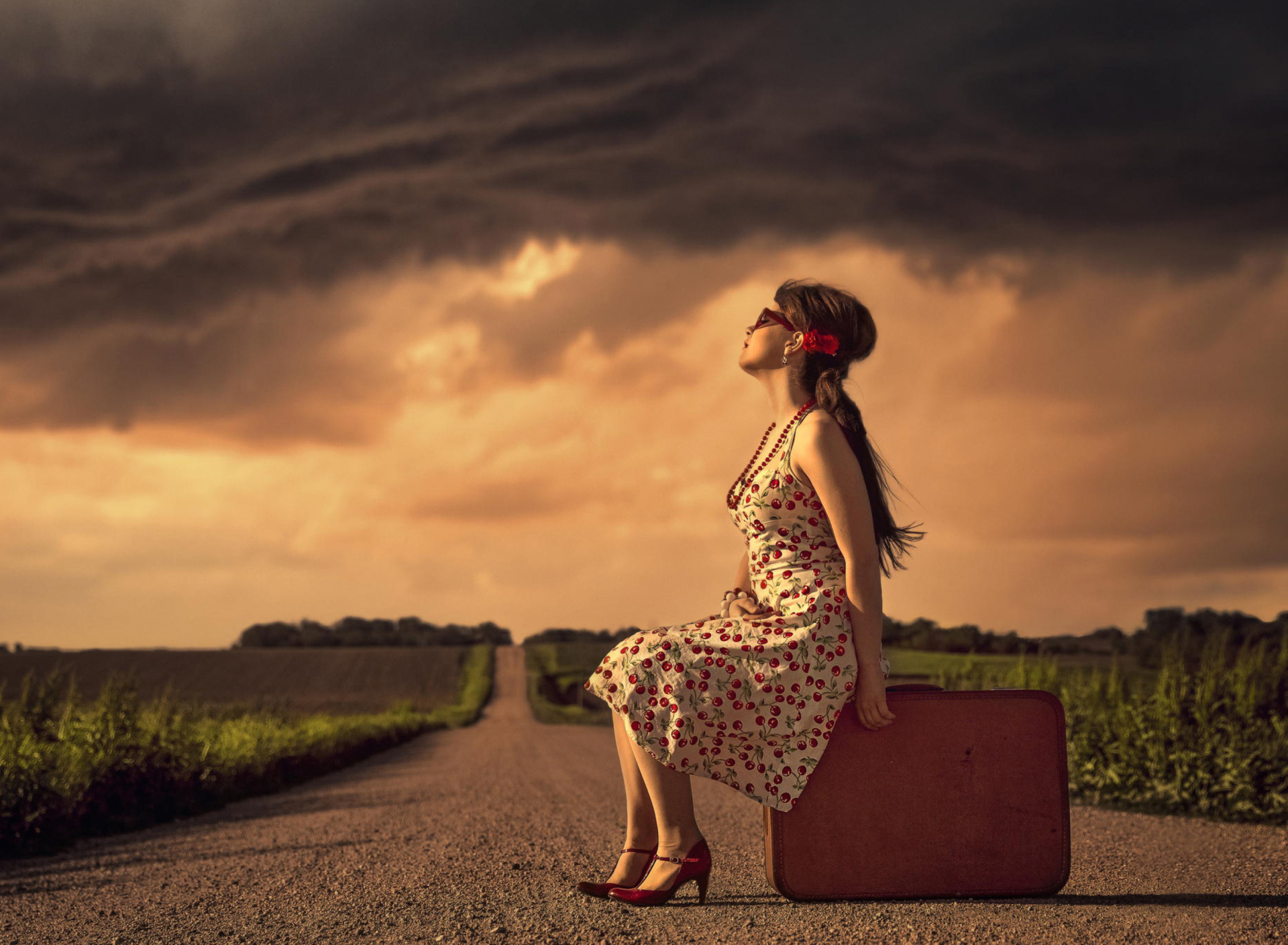 Girl Sitting On Luggage On Road wallpaper 1920x1408