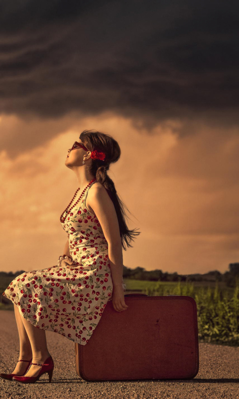 Girl Sitting On Luggage On Road wallpaper 480x800