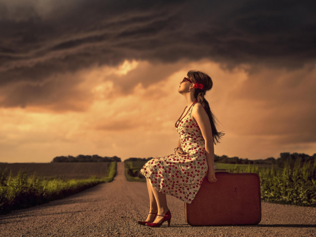 Girl Sitting On Luggage On Road wallpaper 640x480
