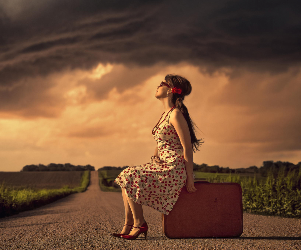 Girl Sitting On Luggage On Road wallpaper 960x800
