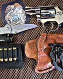 Colt, handcuffs and knife wallpaper 128x160