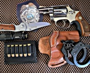 Colt, handcuffs and knife wallpaper 176x144