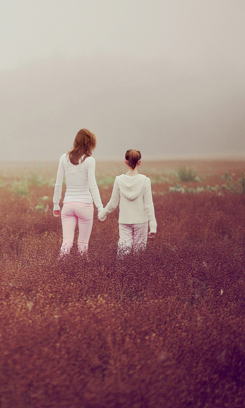 Two Girls Walking In The Field wallpaper 480x800