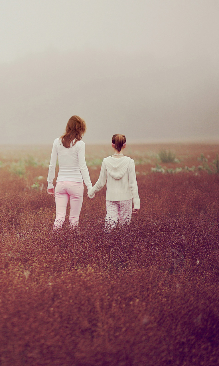 Two Girls Walking In The Field wallpaper 768x1280