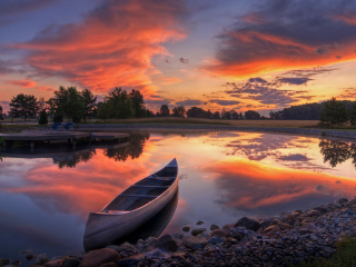 Обои Canoe At Sunset 320x240