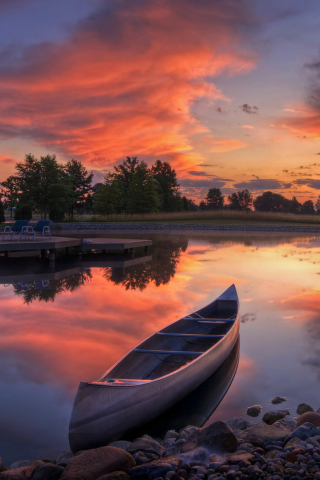 Fondo de pantalla Canoe At Sunset 320x480