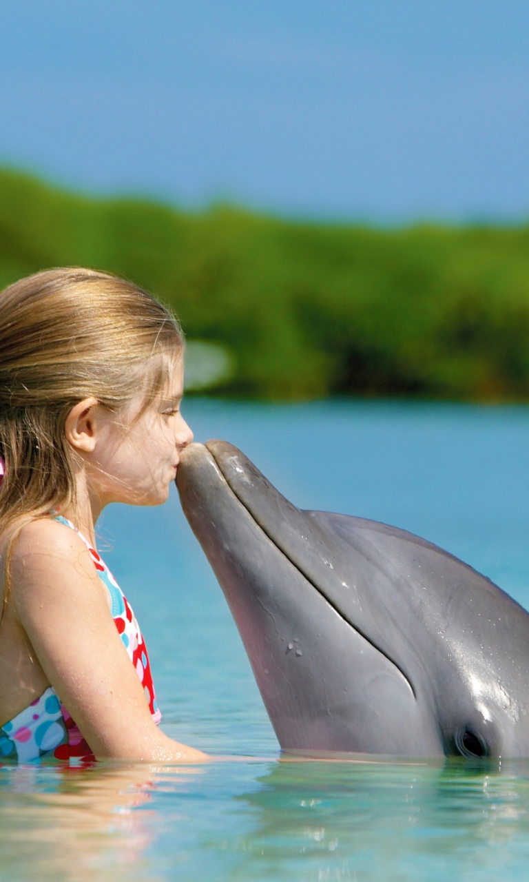 Обои Friendship Between Girl And Dolphin 768x1280