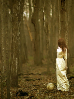 Sfondi Girl And Globe In Forest 240x320