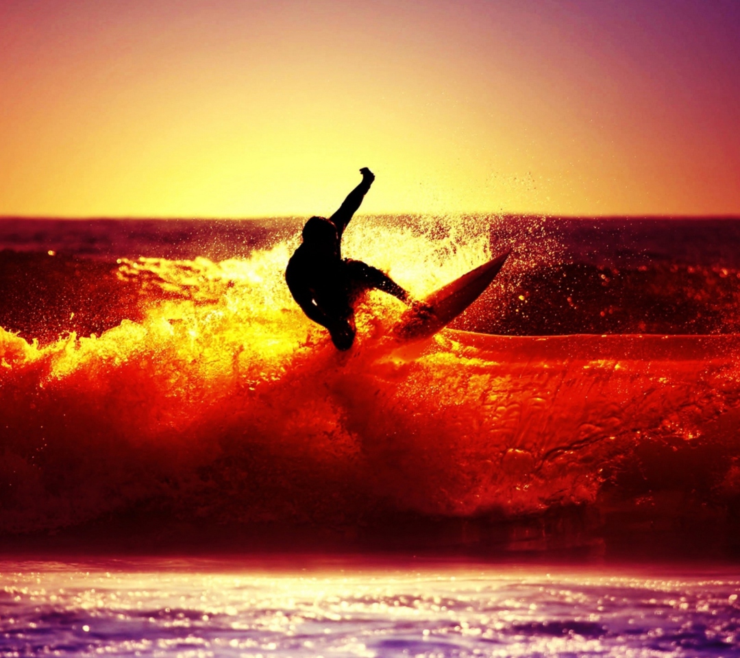 Sfondi Surfing At Sunset 1080x960