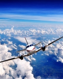 Plane Over The Clouds wallpaper 128x160