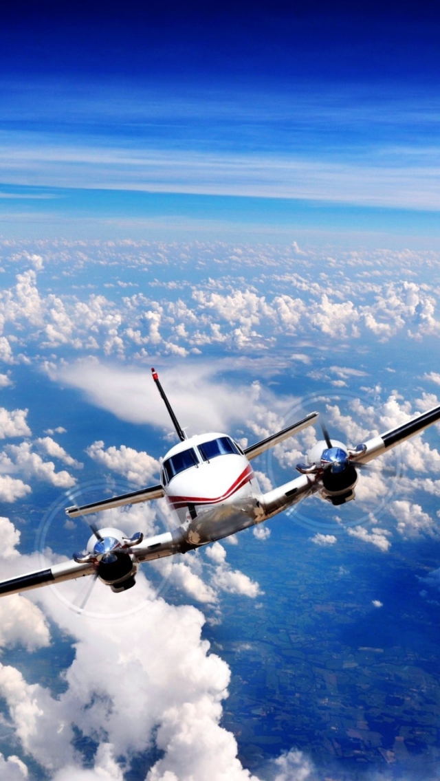 Plane Over The Clouds wallpaper 640x1136