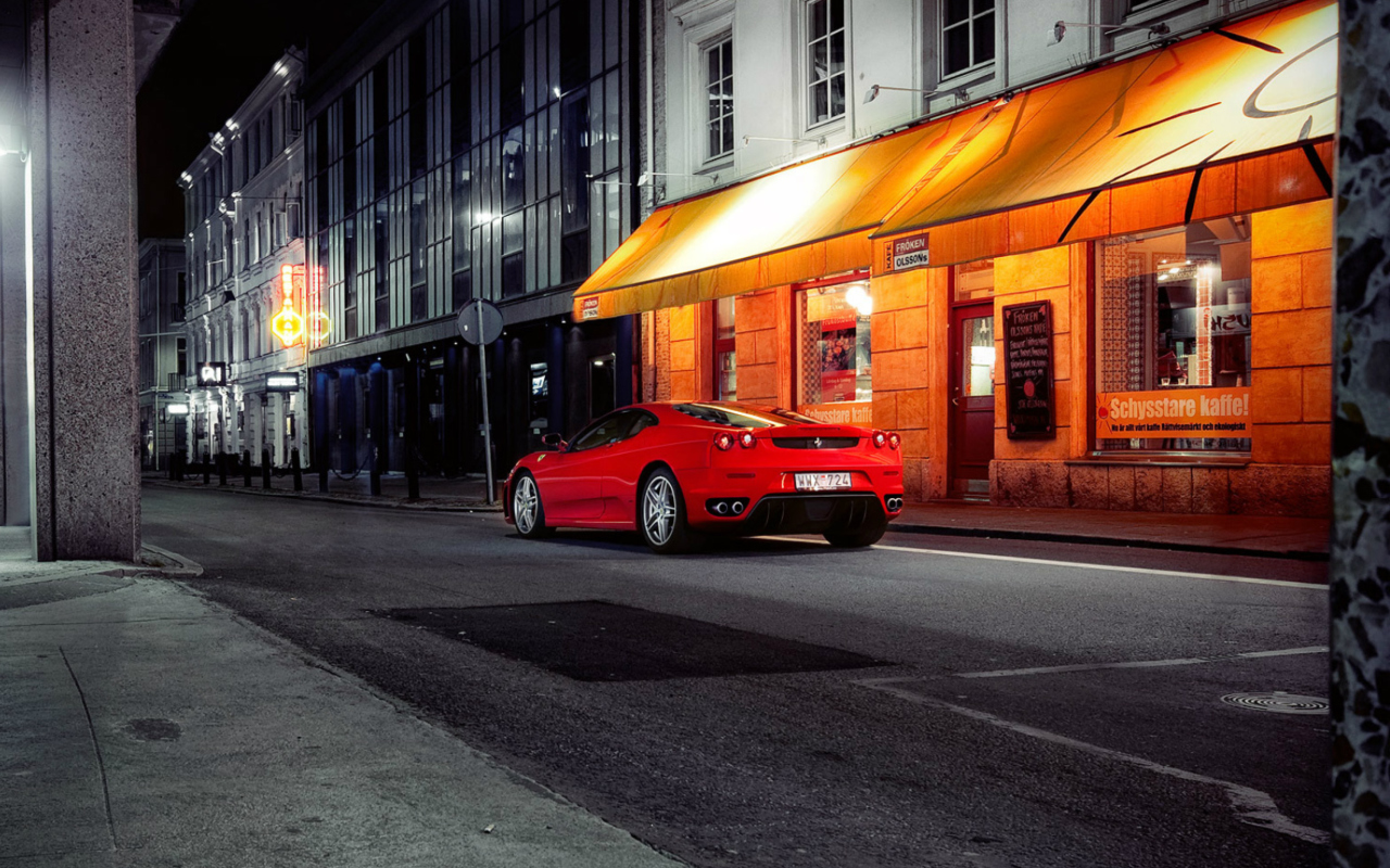 Обои Red Ferrari In City Lights 1280x800