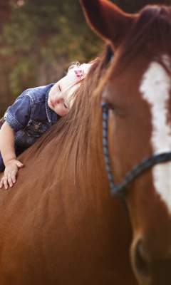 Sfondi Blonde Child On Horse 240x400