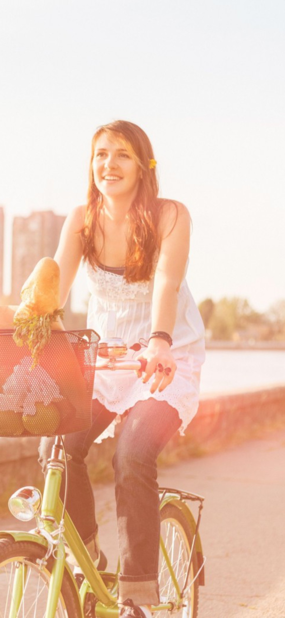 Girl On Bicycle In Sun Lights wallpaper 1170x2532
