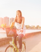 Girl On Bicycle In Sun Lights wallpaper 176x220