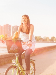 Girl On Bicycle In Sun Lights wallpaper 240x320