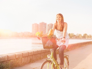Das Girl On Bicycle In Sun Lights Wallpaper 320x240