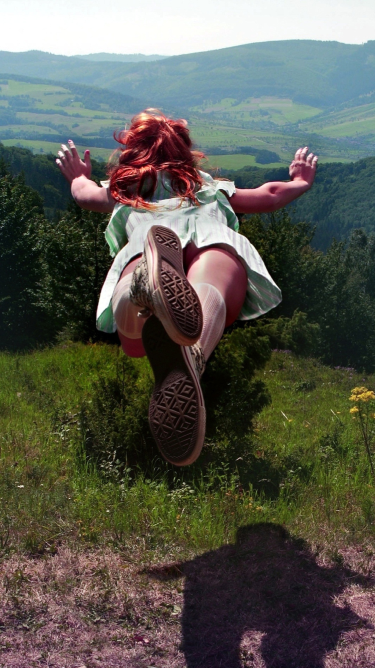 Girl Jumping And Flying wallpaper 750x1334