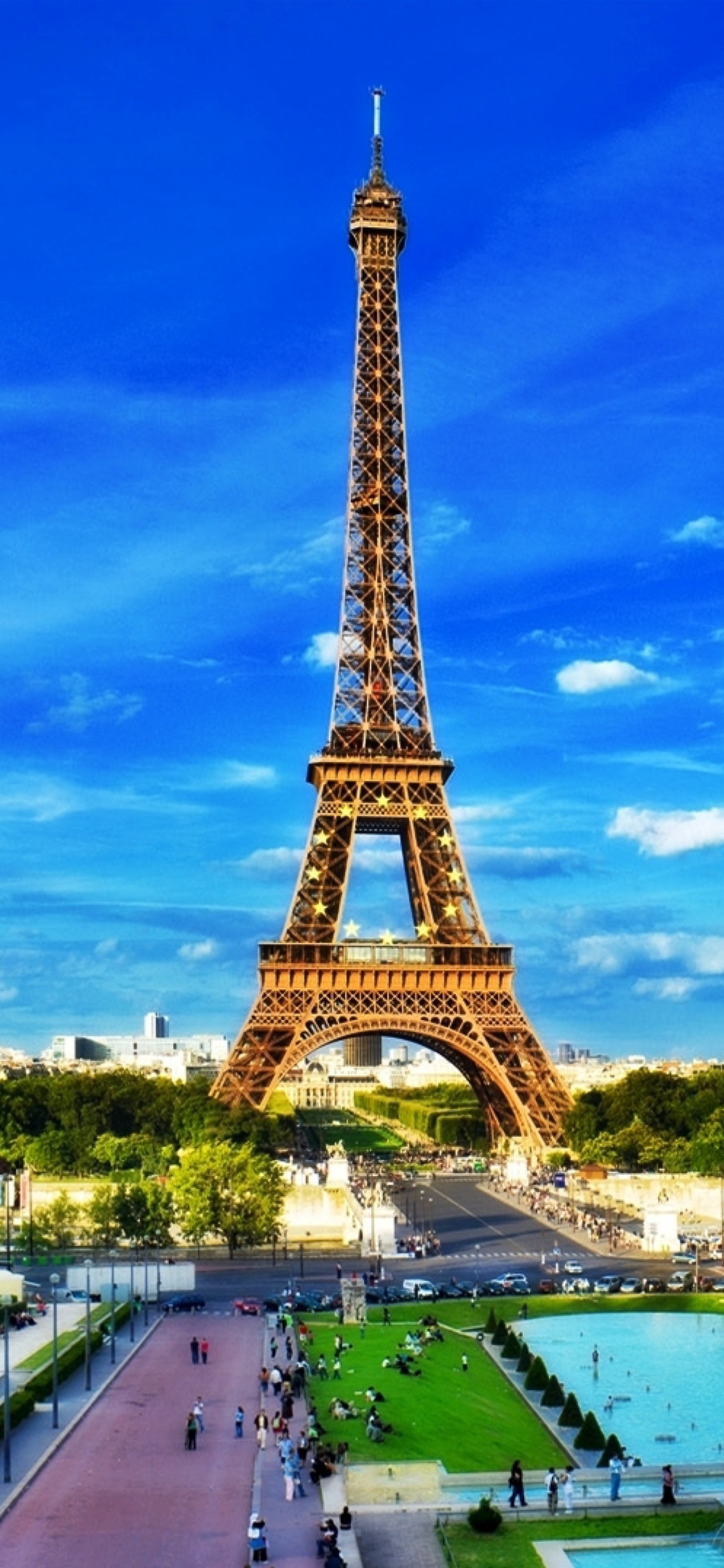 Eiffel Tower on Champ de Mars Greenspace wallpaper 1170x2532